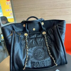 Chanel Tote Bag with Gold Chain and Paris Embossing on white background